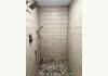 Caribou Cabins: Walk in shower of lower level bath