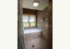 Southern Illinois Eco-Lodge for Sale: Cottage Bathroom Looking to Forest