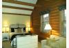 Heartland Country Resort: One of the bedroom in the Log Home