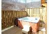 Golden Anchor Luxury Log Cabins and Restaurant: Hot Tub with privacy fence.