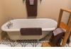 Crystal Key Inn: Antique claw foot tub in second floor add'l bath