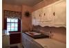 Former Highlander Farmhouse Bed and Breakfast: laundry room sink