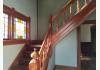2195 SW Mills Street: Original stair case and stained glass window