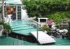 Island Cottage Oceanfront Boutique Inn: Enchanted Garden. pond & water feature