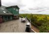 Cedar Pond House: Backyard patio/deck overlooking countryside