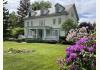 Georgian Manor Inn - B&B: Front west side view blooming Rhod