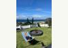 Luxury Modern Beach House with 3 Airbnb Cottages: Windy days in the front garden 